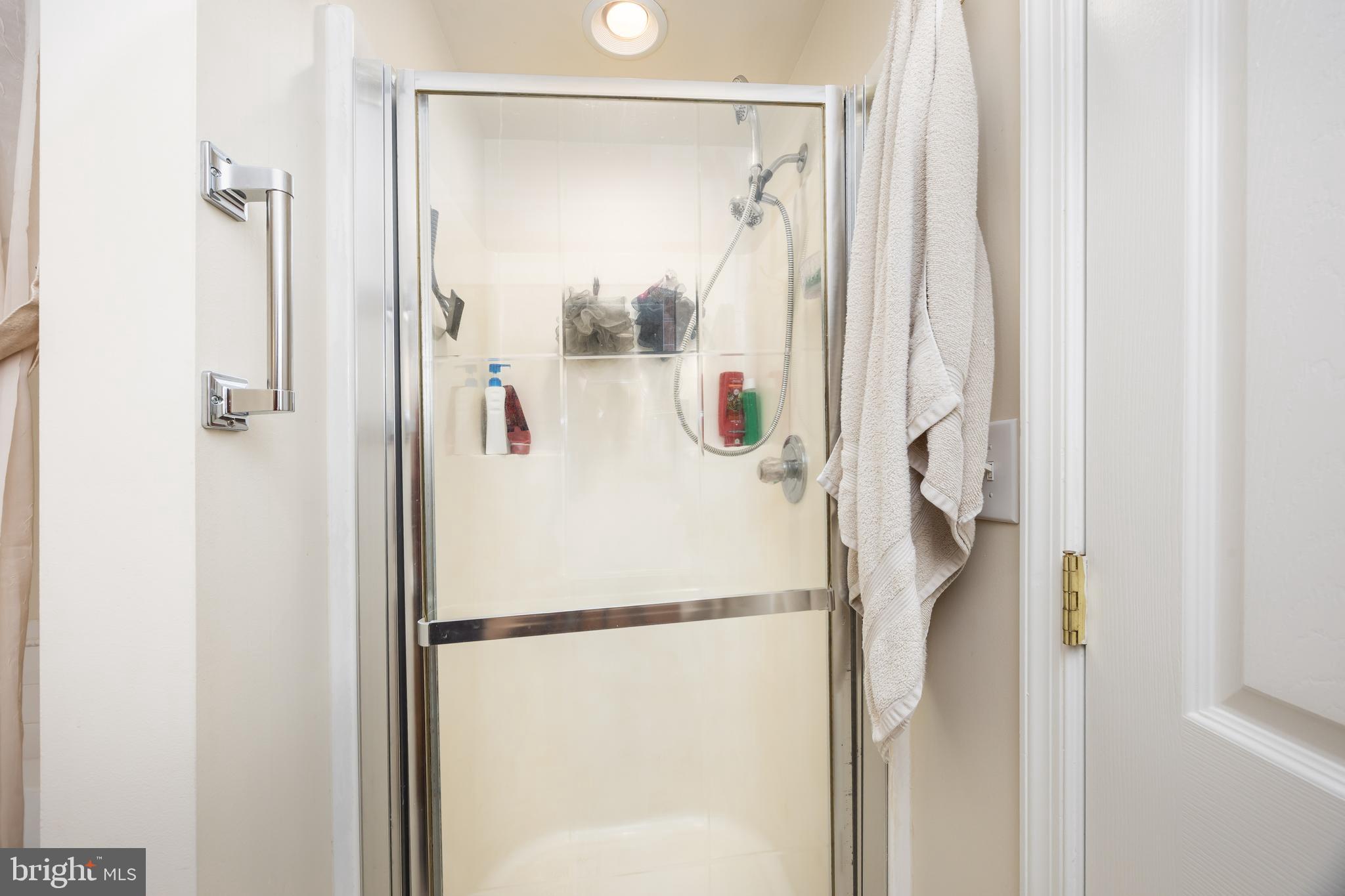 911 Outten Road Salisbury, MD 21804 - Photo 21 of 36 a white cabinet with shower and a mirror