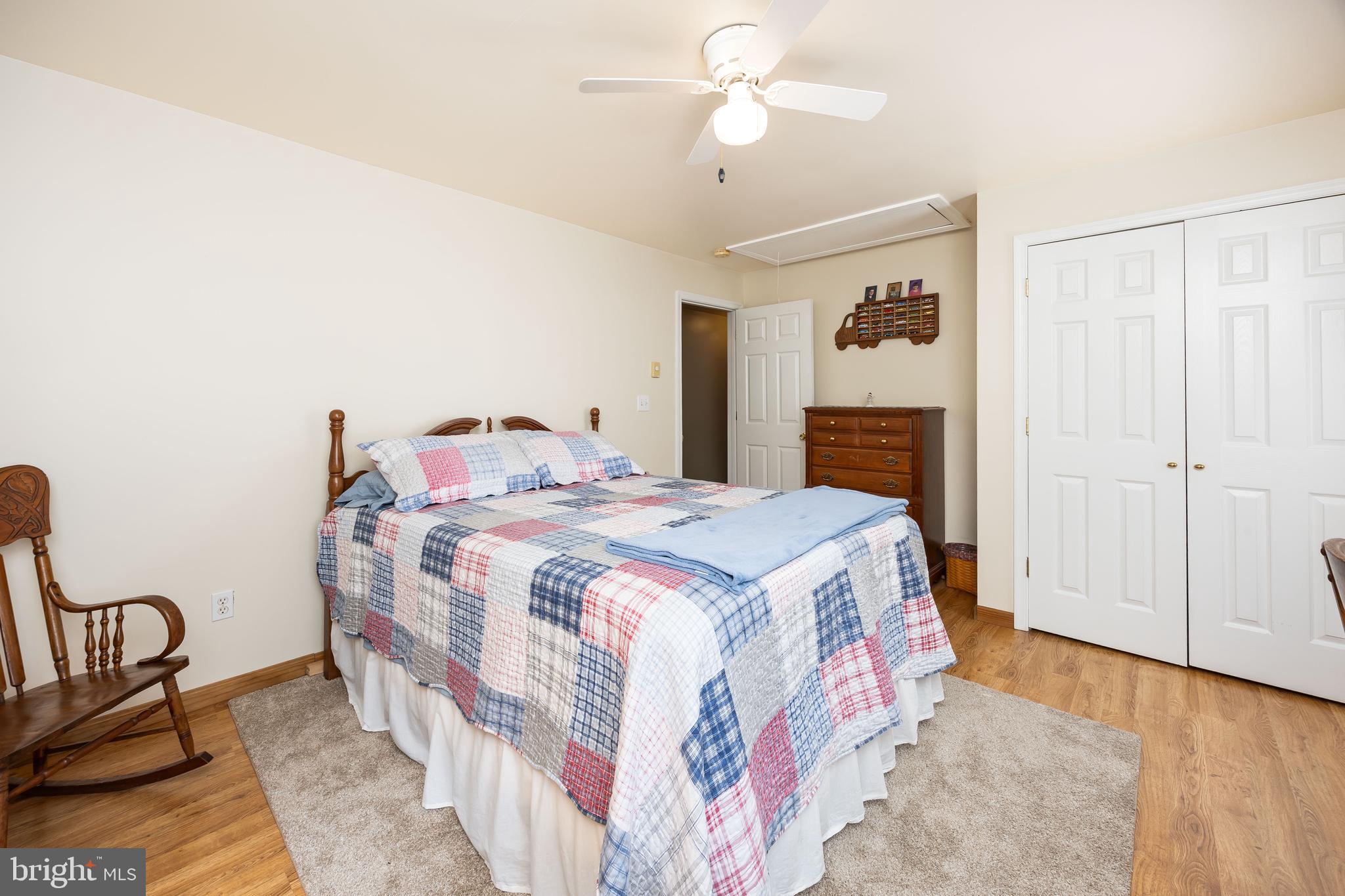 911 Outten Road Salisbury, MD 21804 - Photo 25 of 36 a bedroom with a bed and chair