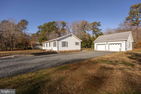 a view of a house with a outdoor space and porch