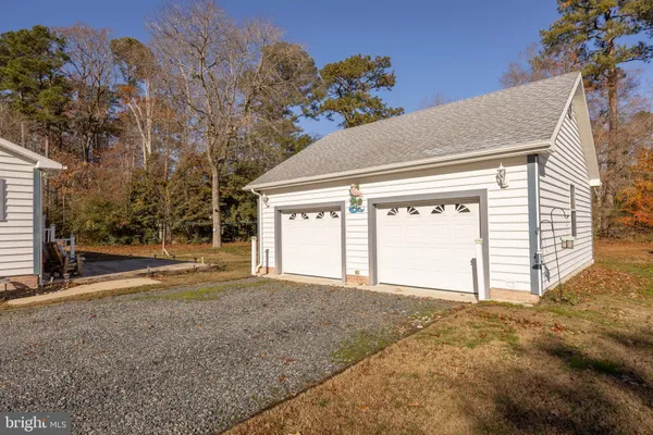 a view of a house with swimming pool and a yard