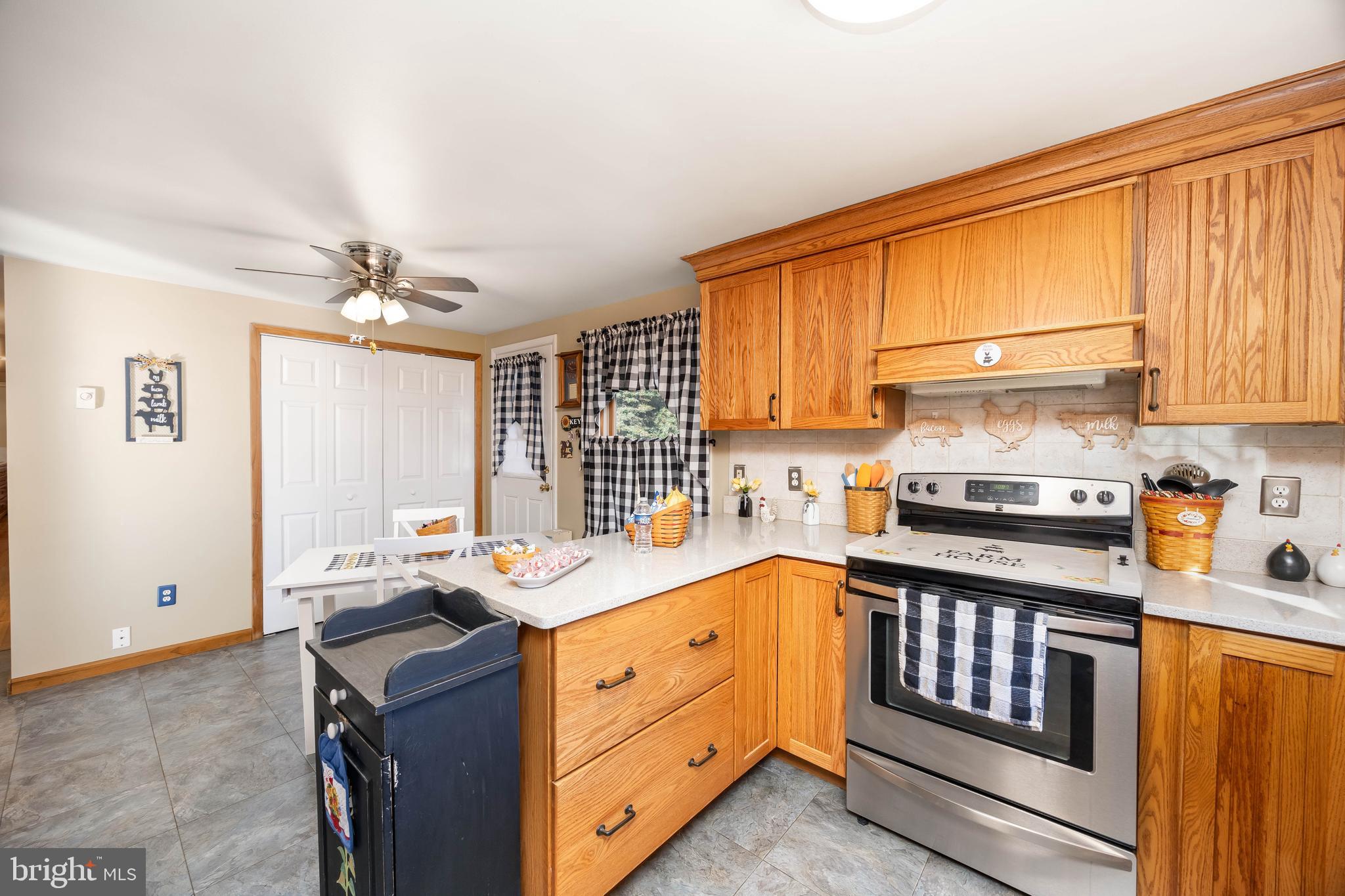 911 Outten Road Salisbury, MD 21804 - Photo 4 of 36 a kitchen with a sink stove and cabinets