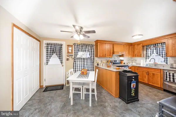 a kitchen with stainless steel appliances granite countertop a stove and a refrigerator