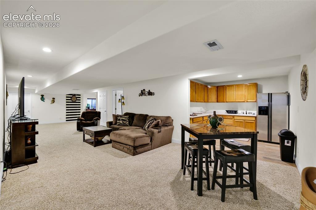 12266 Crystal Downs Road Peyton, CO 80831 - Photo 25 of 50 Family room w kitchenette