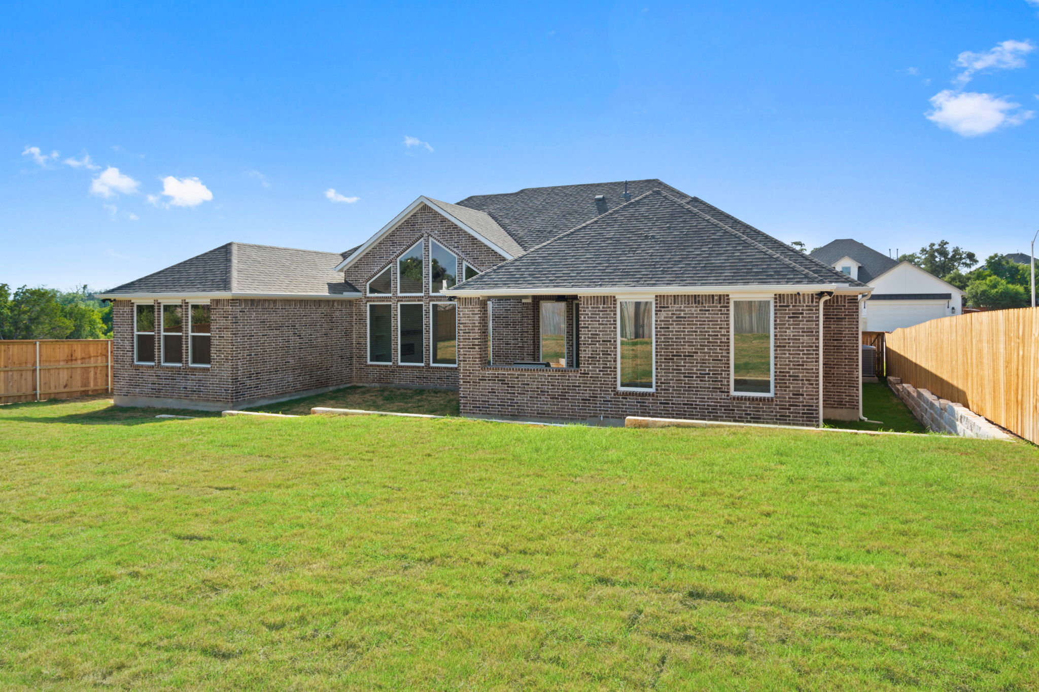 308 Axis Loop Georgetown, TX 78628 - Photo 36 of 40 a front view of a house with a garden