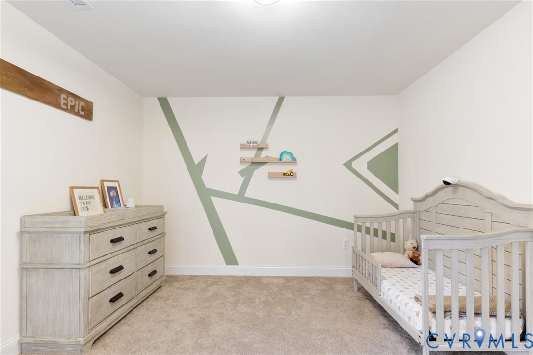 2715 Ballsville Road Powhatan, VA 23139 - Photo 22 of 30 Bedroom with a crib and light colored carpet