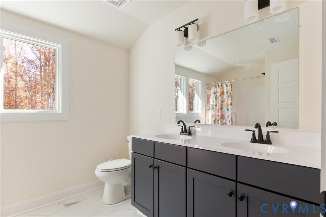 2715 Ballsville Road Powhatan, VA 23139 - Photo 25 of 30 Full bathroom featuring double vanity, a shower wi
