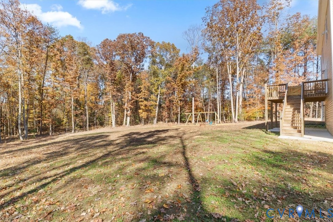 2715 Ballsville Road Powhatan, VA 23139 - Photo 29 of 30 View of grassy yard with a playground, a wooden de