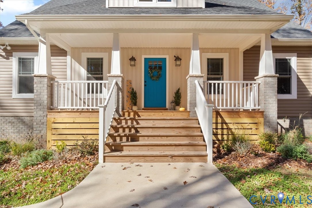 2715 Ballsville Road Powhatan, VA 23139 - Photo 8 of 30 Doorway to property with a shingled roof and a por