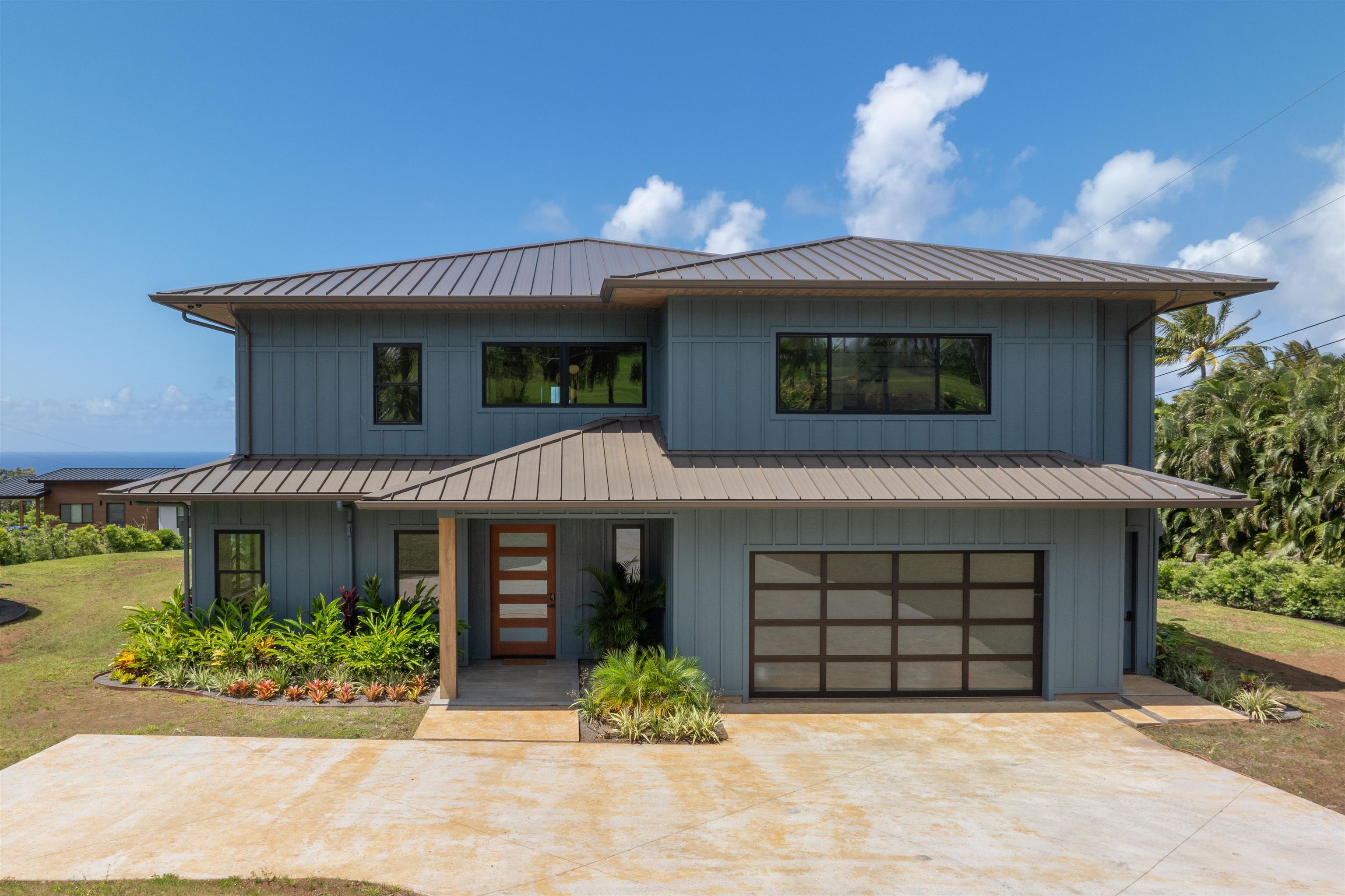 111 Mehana Road, Unit A Haiku, HI 96708 - Photo 4 of 50 a front view of a house with garden