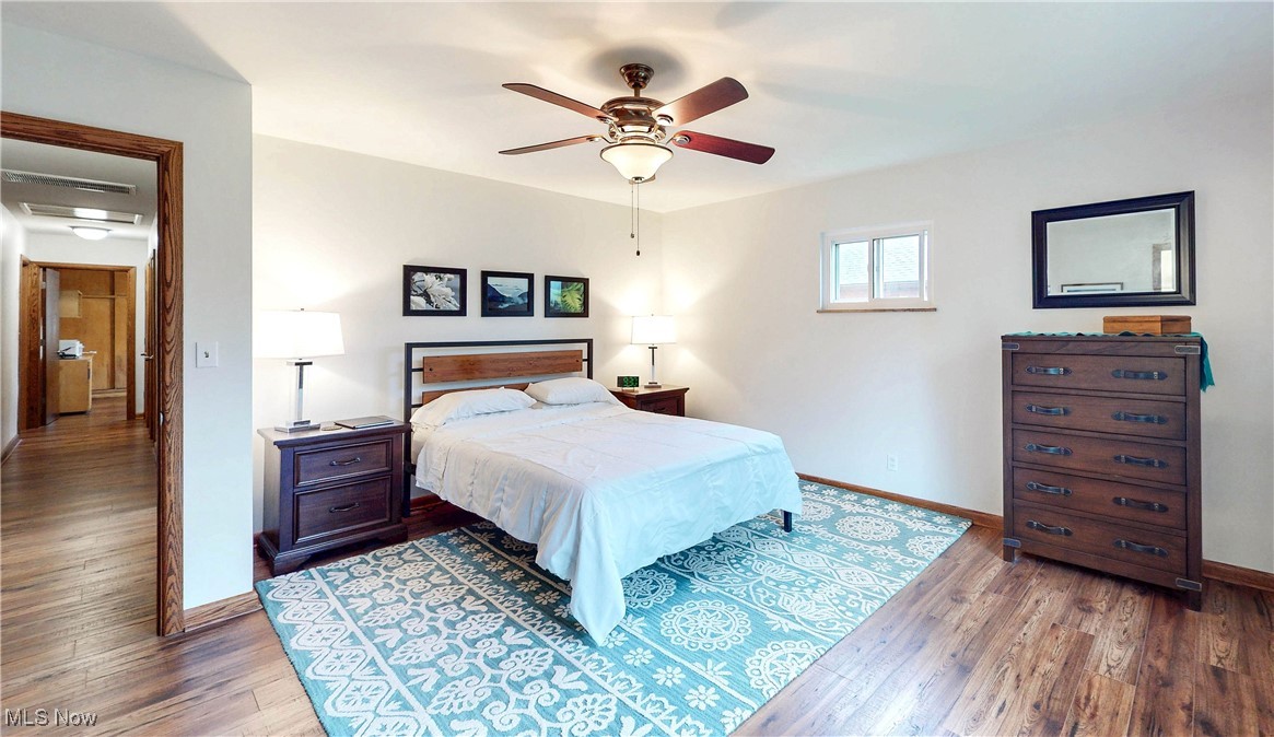 891 Sovereign Road Akron, OH 44303 - Photo 9 of 30 Bedroom with baseboards, wood finished floors, and a ceiling fan