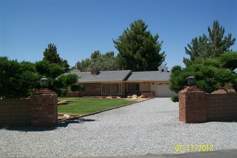 14242 Gayhead Road Apple Valley, CA 92307 - Photo 1 of 1 front view of a house with a yard