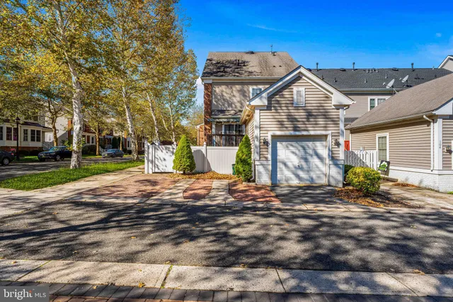 a large kitchen with stainless steel appliances granite countertop a stove a sink dishwasher a refrigerator and a oven