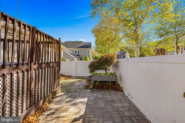 a large kitchen with stainless steel appliances granite countertop a stove and a refrigerator