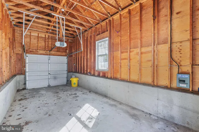 a view of a livingroom with an empty space and a fireplace