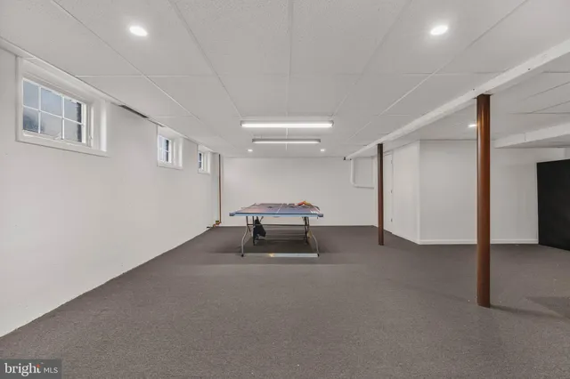 a bathroom with a sink toilet a mirror and shower