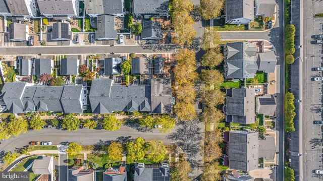 a front view of a residential apartment building with a yard