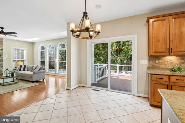 a view of a livingroom with furniture wooden floor and windows