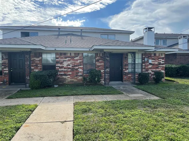 front view of a building with a yard
