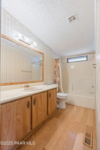 an aerial view of a town with ocean view