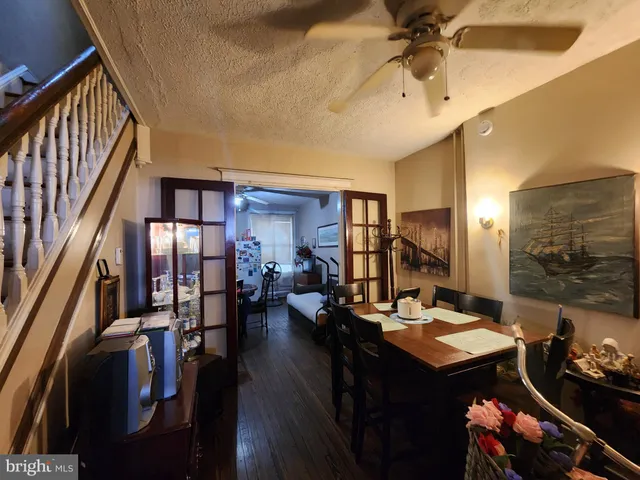 a living room with lots of furniture and chandelier