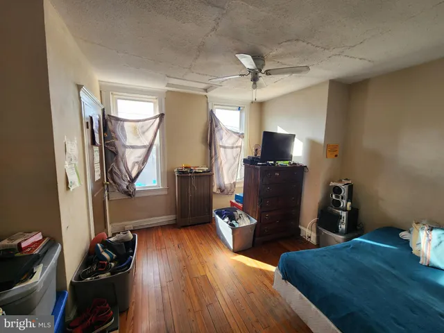 a view of a workspace with furniture and a flat screen tv