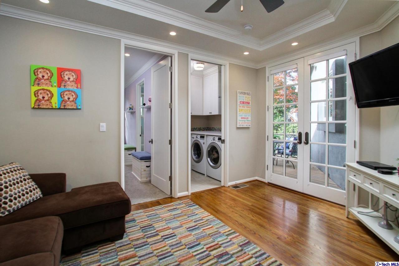 150 Sierra View Road Pasadena, CA 91105 - Photo 14 of 29 a living room with furniture and a flat screen tv