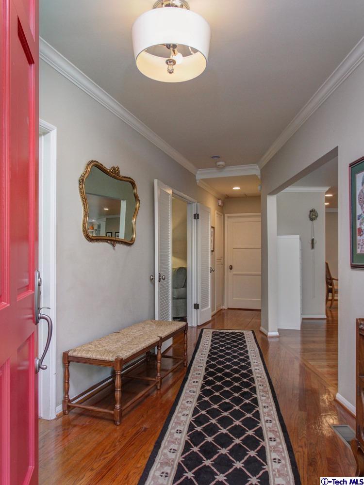 150 Sierra View Road Pasadena, CA 91105 - Photo 5 of 29 a hallway with front door wooden floor and windows