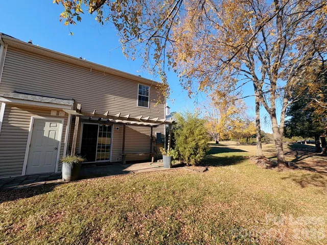 a view of a backyard of the house