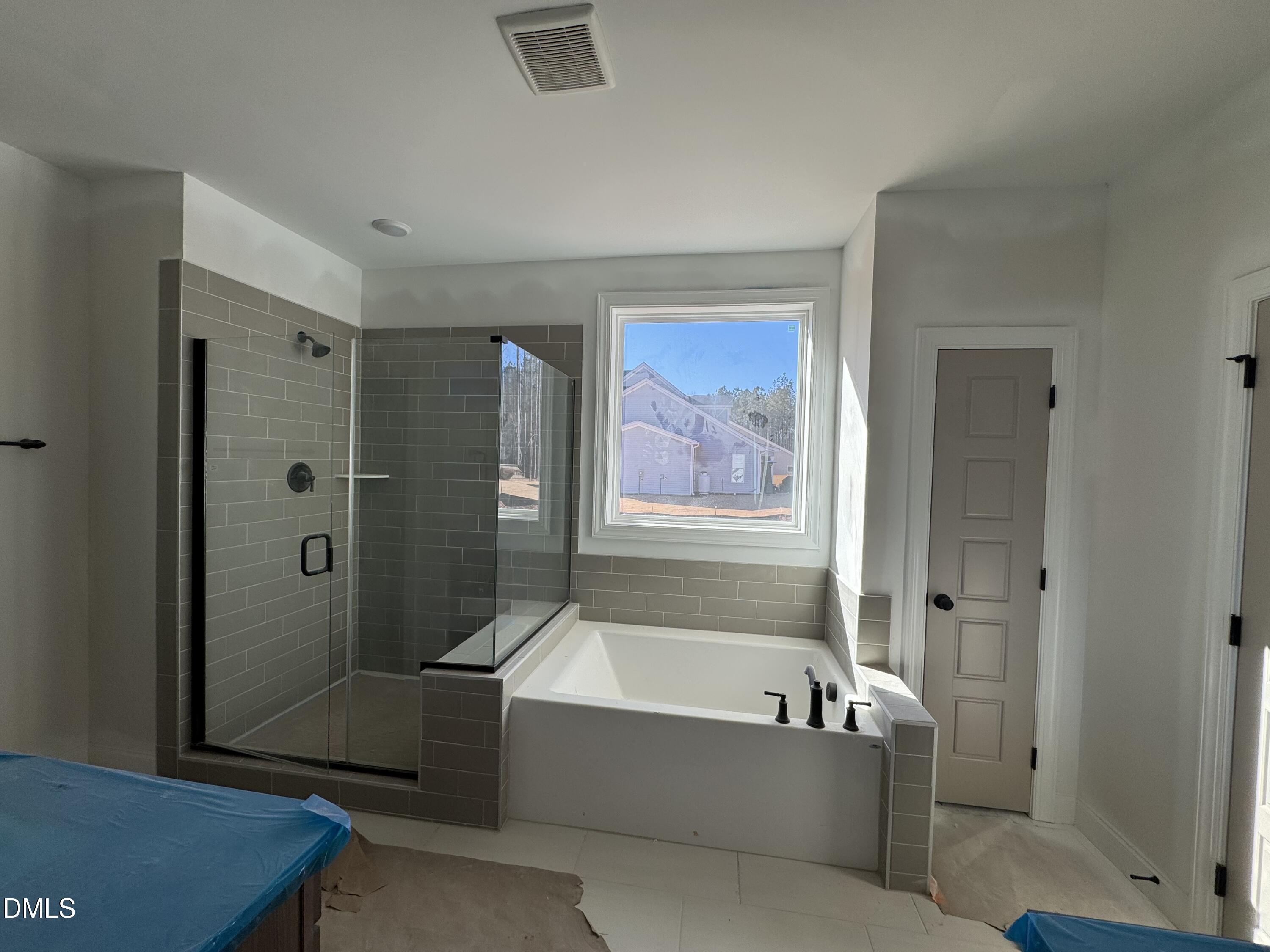 134 West Victoria Rdg Drive, Unit 22 Selma, NC 27576 - Photo 13 of 18 a bathroom with a tub a toilet and a shower