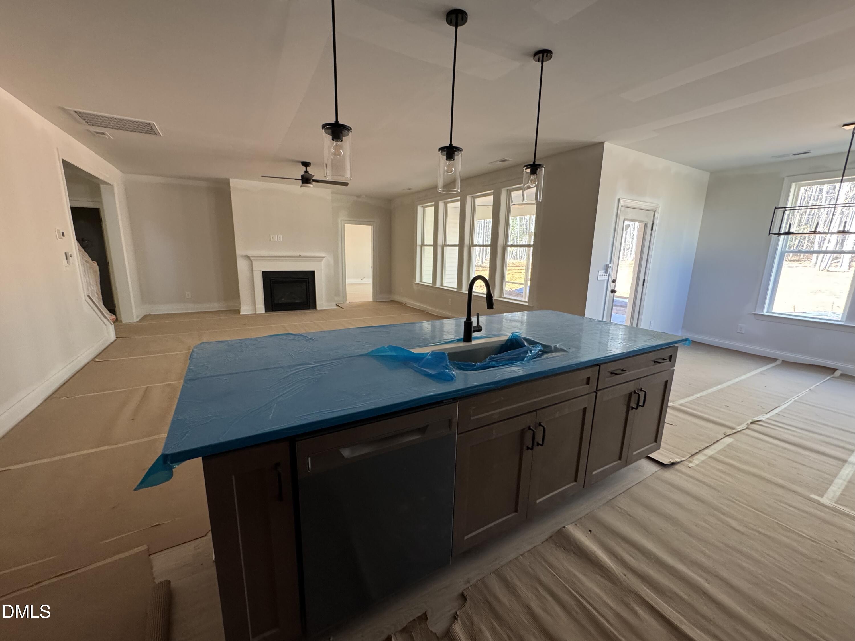134 West Victoria Rdg Drive, Unit 22 Selma, NC 27576 - Photo 7 of 18 a kitchen with sink cabinets and wooden floor