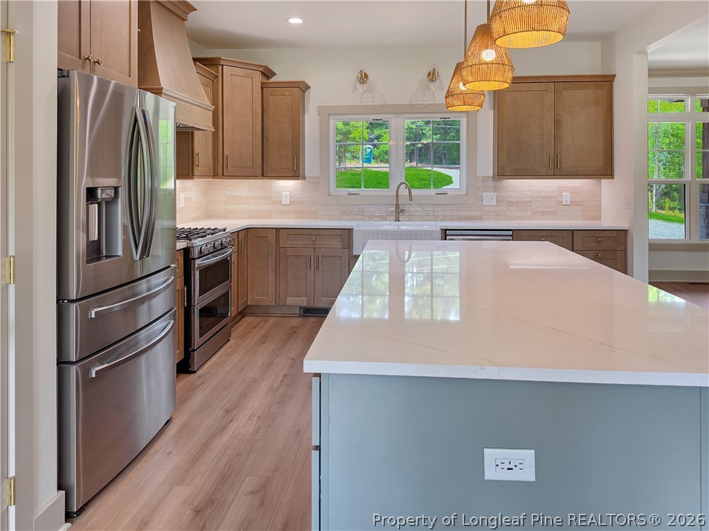 900 Niagara Carthage Road Carthage, NC 28327 - Photo 5 of 38 a kitchen with stainless steel appliances a refrigerator sink and stove