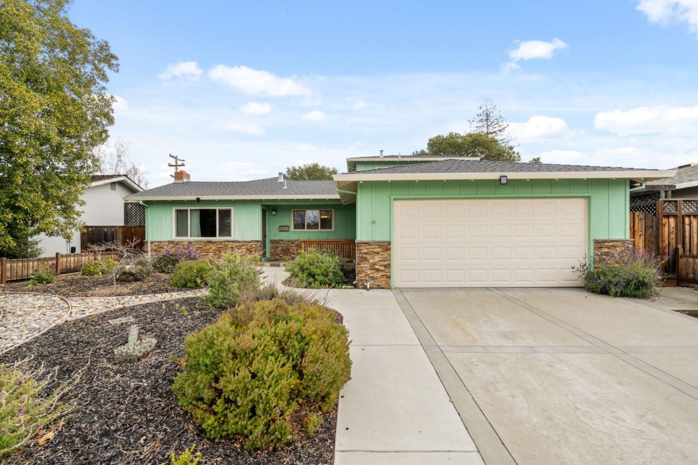 4198 Rondeau Drive San Jose, CA 95124 - Photo 1 of 43 a front view of house with yard and trees around