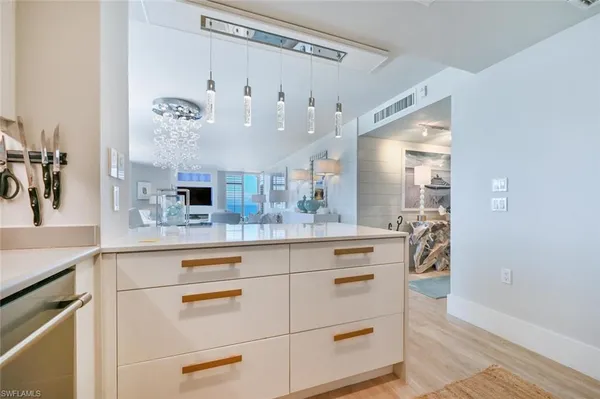 a spacious bathroom with a sink a mirror and a shower