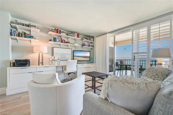 a living room with furniture and a table