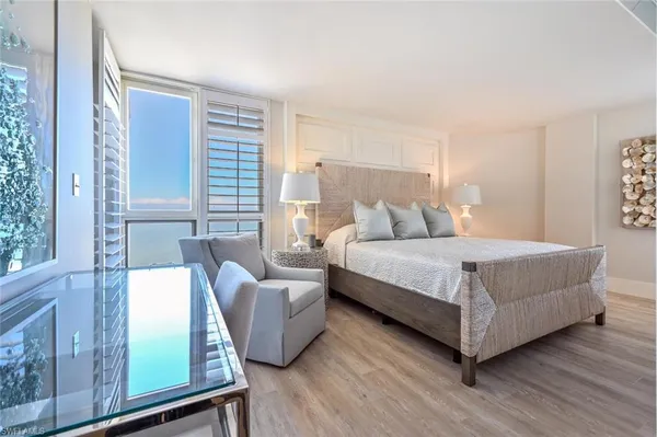 a bedroom with a bed and a couch