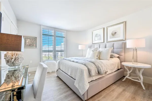 a bed room with a bed and a table