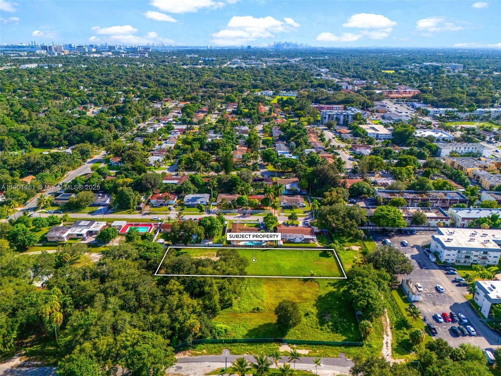 152-nd Street Northeast 152nd Street Miami, FL 33162 - Photo 9 of 16 an aerial view of residential houses with outdoor space and trees