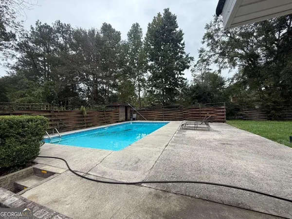 a view of a swimming pool and outdoor space