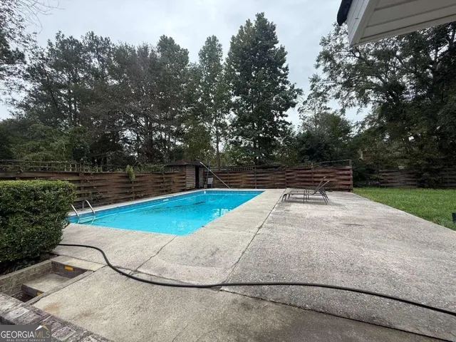 a view of a swimming pool and outdoor space