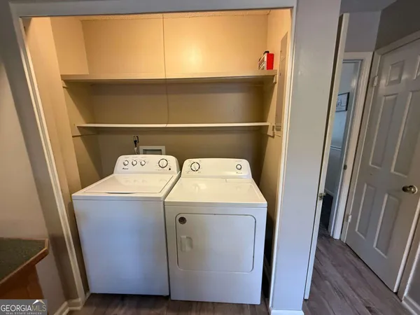 a utility room with washer and dryer