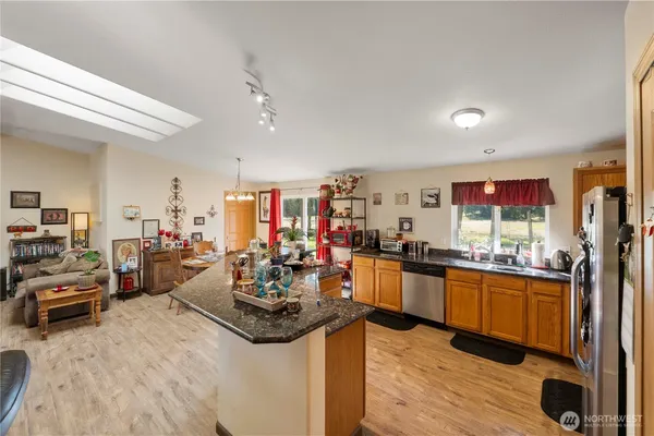 a view of a living room and kitchen