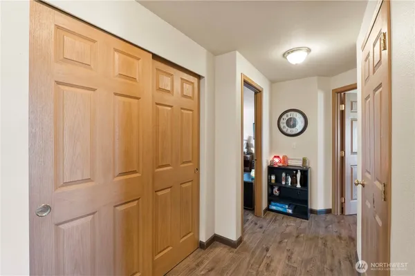 a view of a livingroom with wooden floor and a window