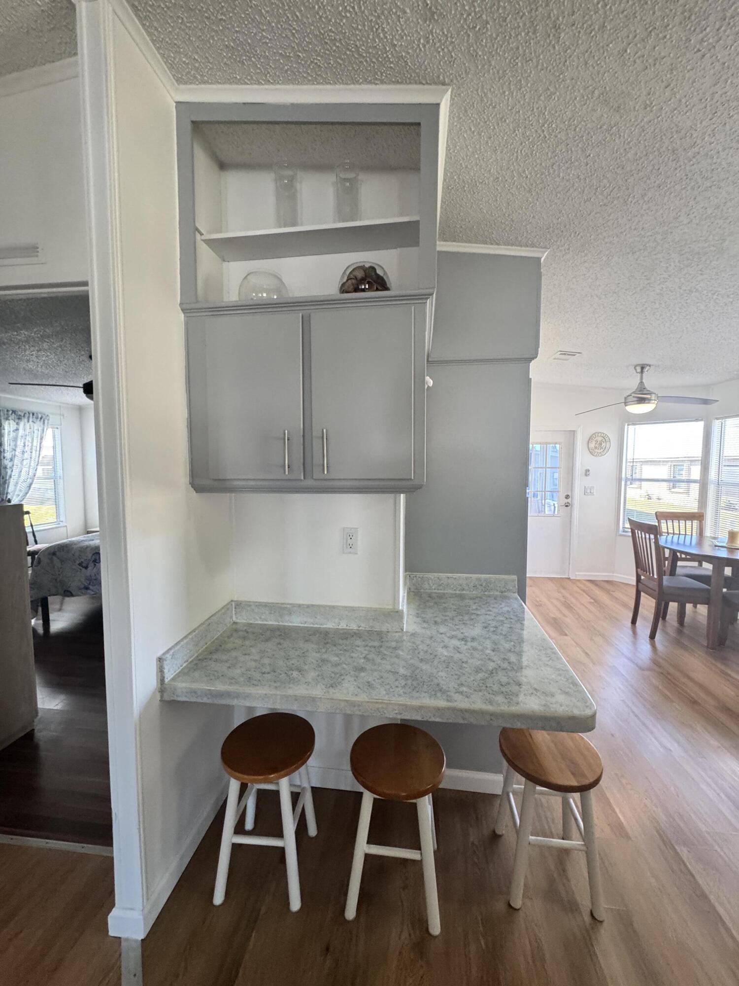 13965 Garza Court Fort Pierce, FL 34951 - Photo 18 of 44 a kitchen with a table and chairs in it