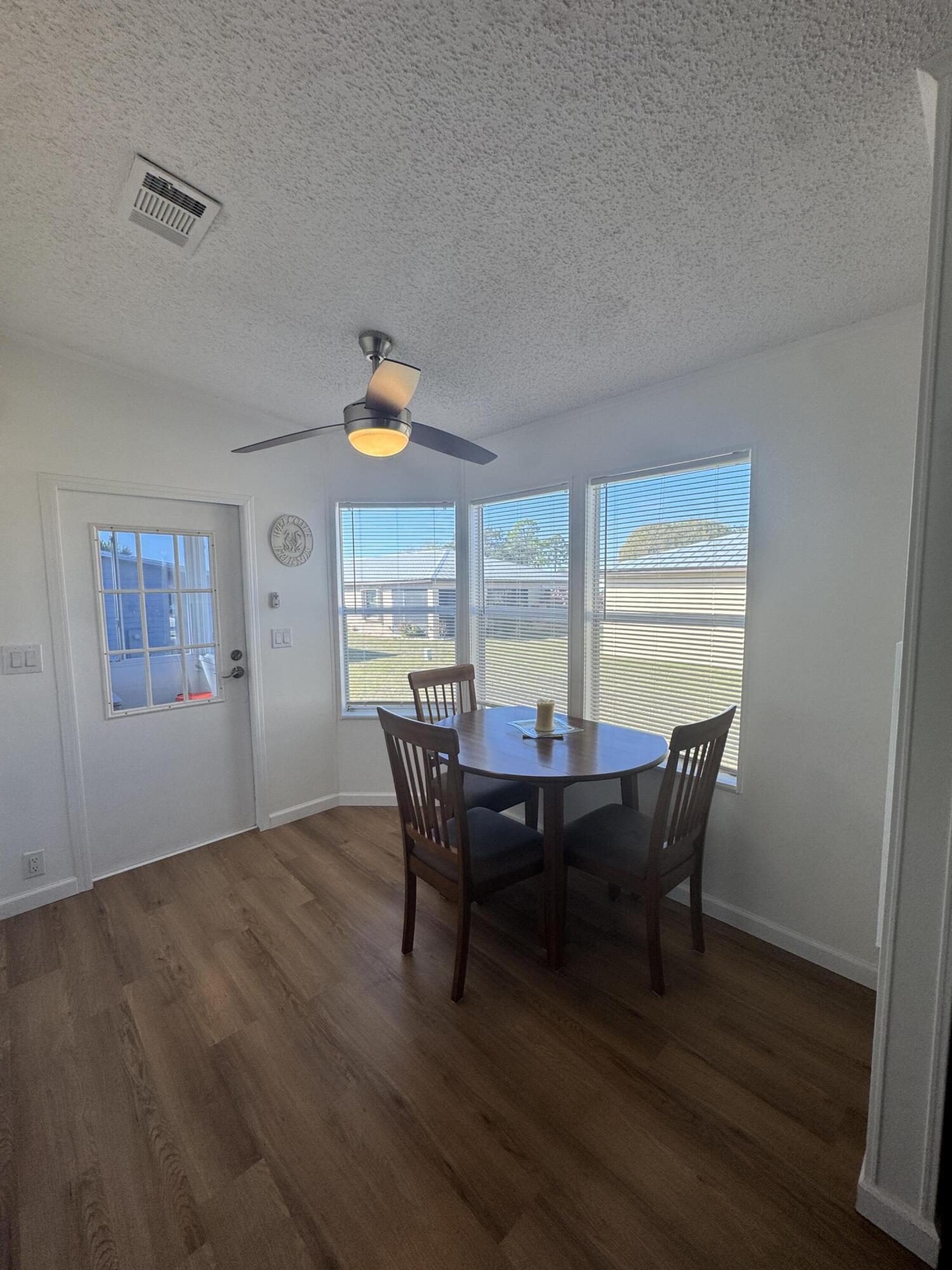 13965 Garza Court Fort Pierce, FL 34951 - Photo 20 of 44 a view of a dining room with furniture and window
