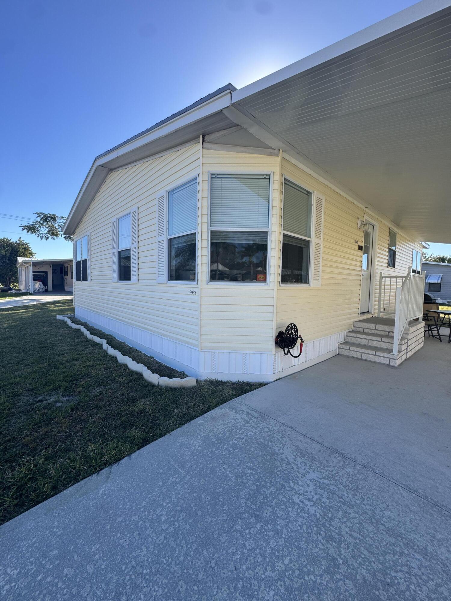 13965 Garza Court Fort Pierce, FL 34951 - Photo 2 of 44 a view of a house with backyard