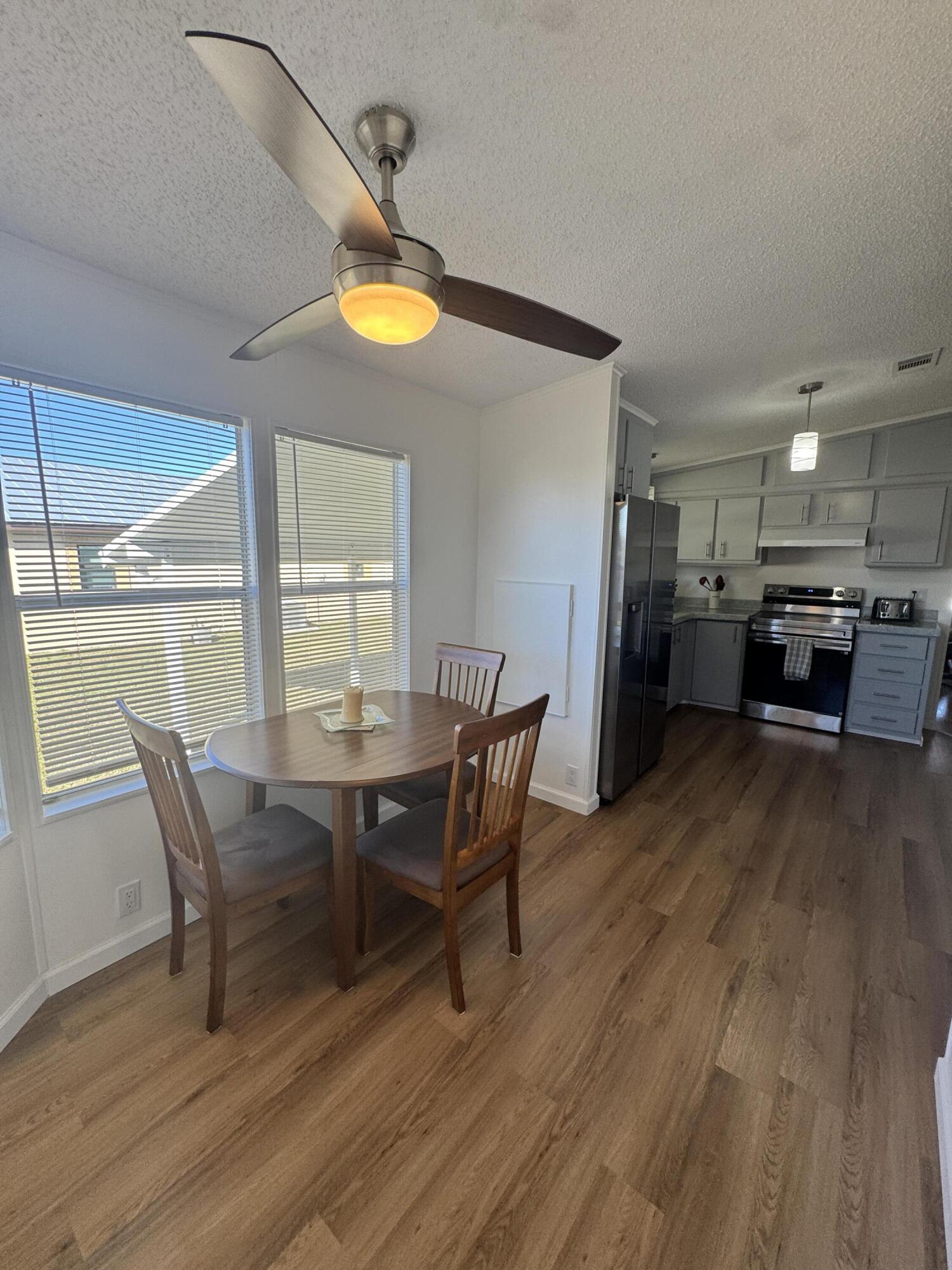 13965 Garza Court Fort Pierce, FL 34951 - Photo 21 of 44 a view of a dining room with furniture and a window