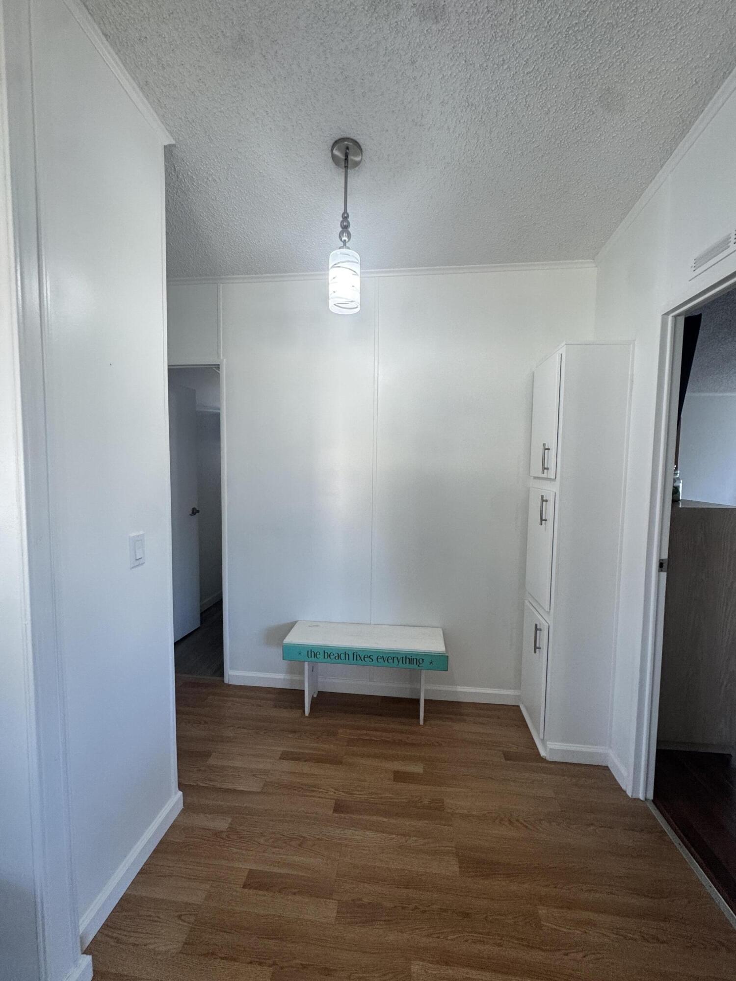 13965 Garza Court Fort Pierce, FL 34951 - Photo 28 of 44 a view of empty room with wooden floor