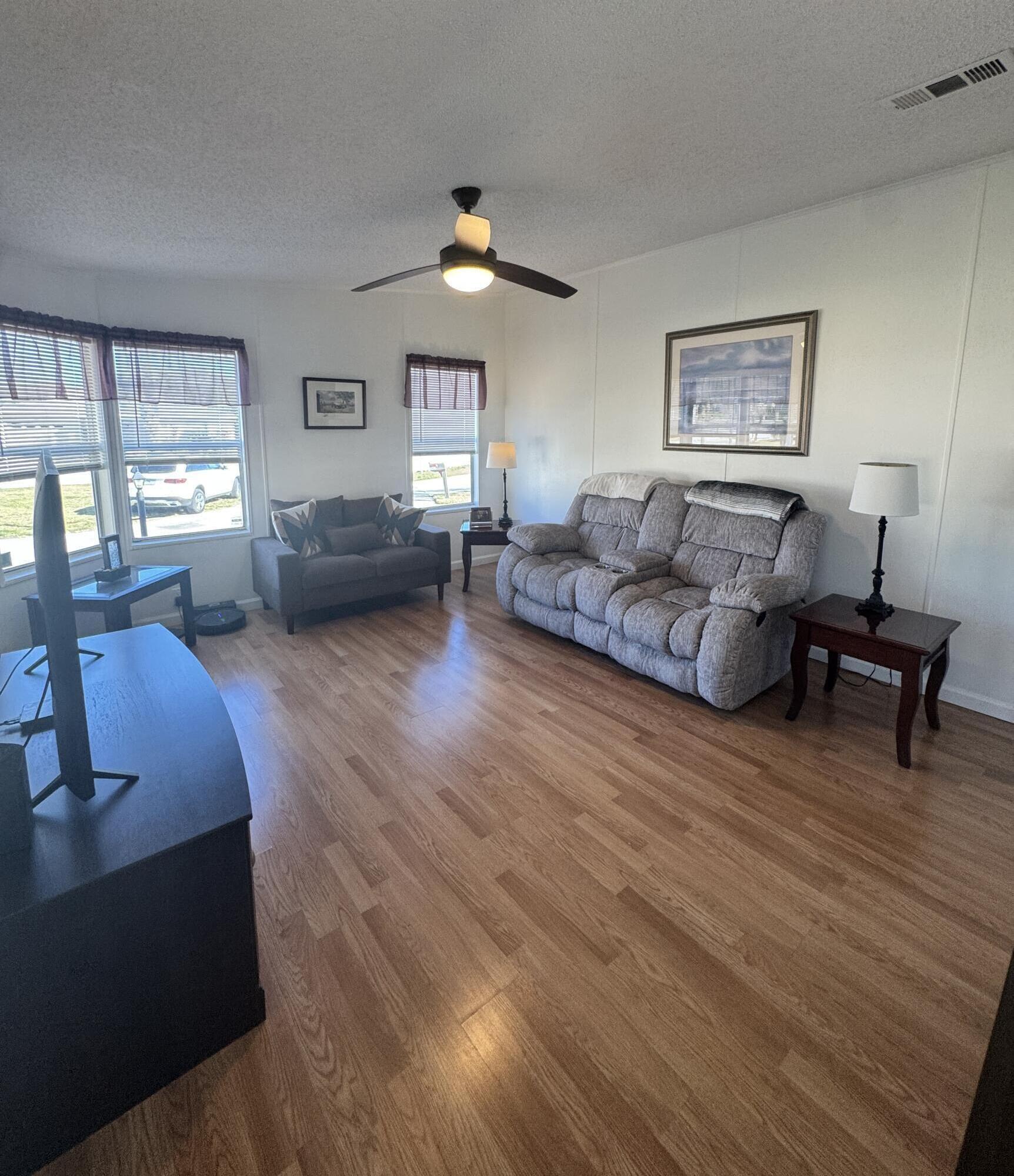 13965 Garza Court Fort Pierce, FL 34951 - Photo 30 of 44 a living room with furniture and a large window