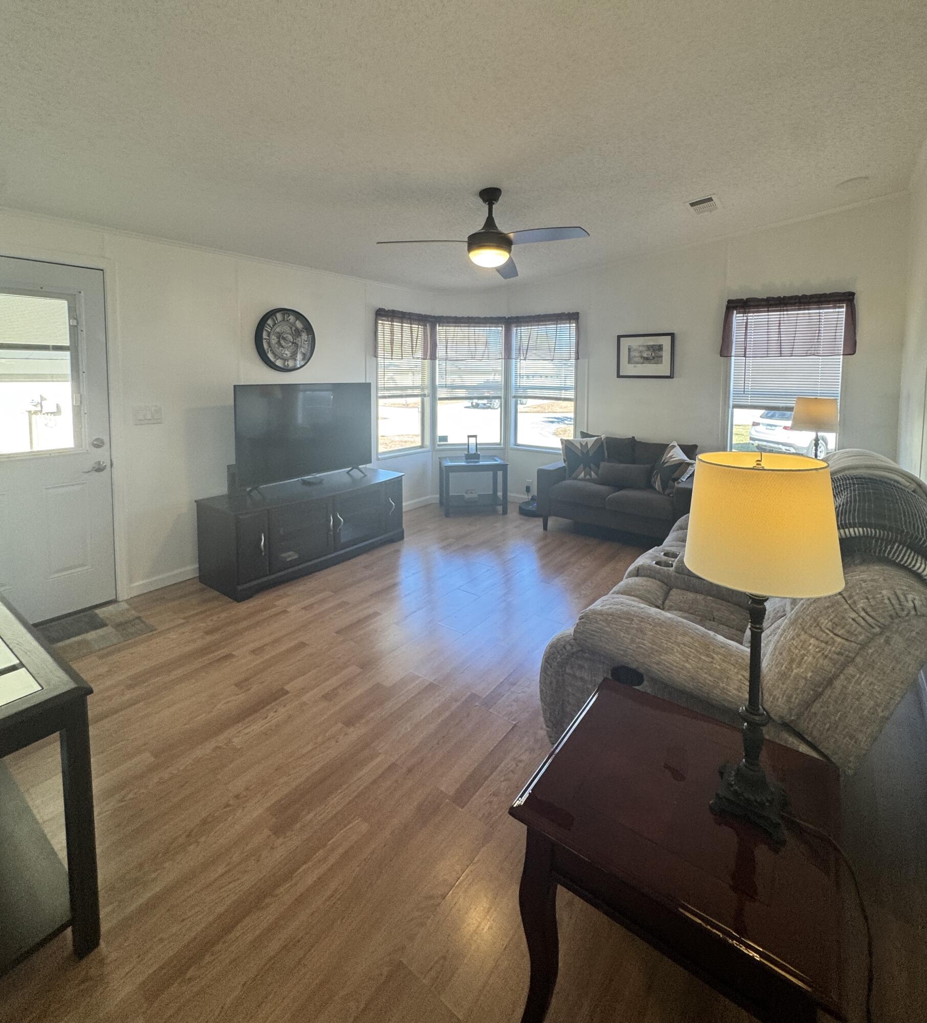 13965 Garza Court Fort Pierce, FL 34951 - Photo 31 of 44 a living room with furniture and a flat screen tv