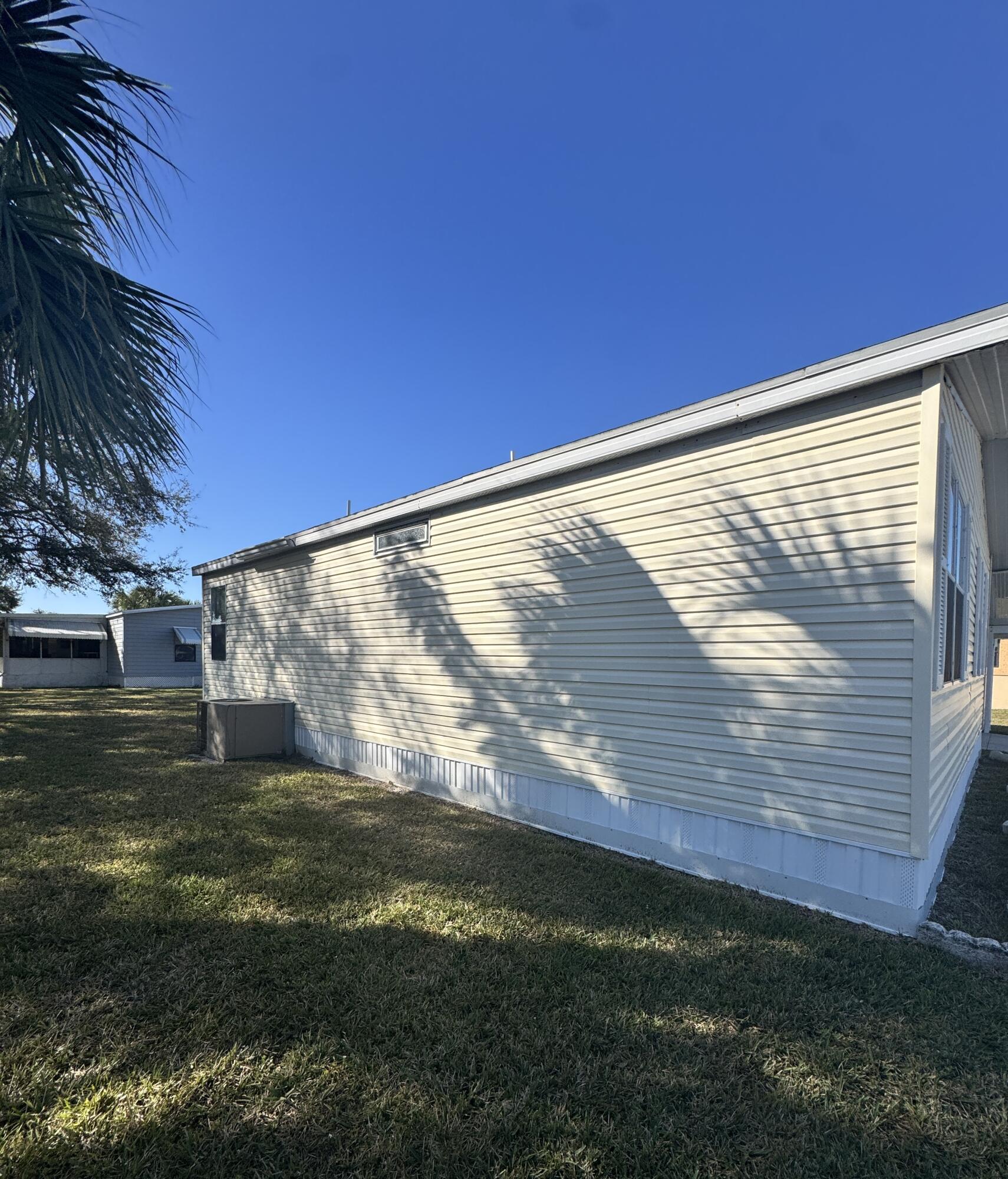 13965 Garza Court Fort Pierce, FL 34951 - Photo 6 of 44 a view of a backyard with plants